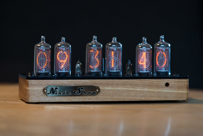 Nixie clock in solid wooden enclosure with a plastic bottom cover