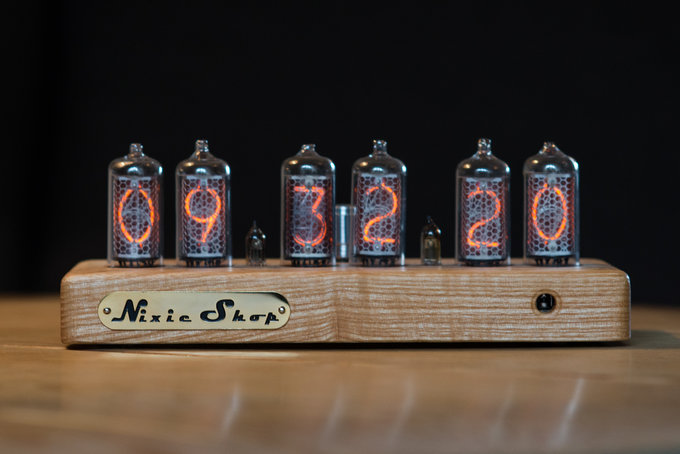 Nixie clock in solid wooden enclosure with a plastic top cover