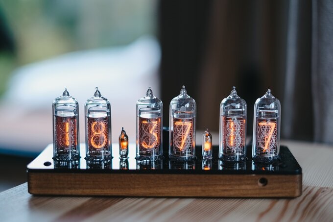 Nixie clock in solid wooden enclosure with a plastic bottom cover