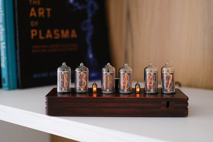 Wooden Nixie clock with parallel grooves.